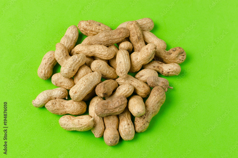Peanuts on a bright green background. Peanuts on a bright green background.