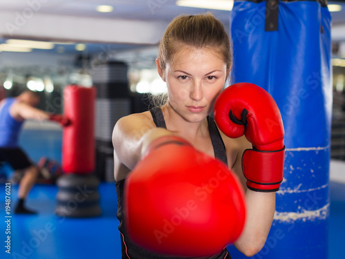 Woman boxing in gym © JackF