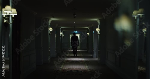 Man going in dark corridor