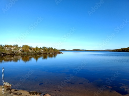 lake in the tundra among Karelian birches