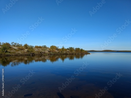 lake in the tundra among Karelian birches © Maxim