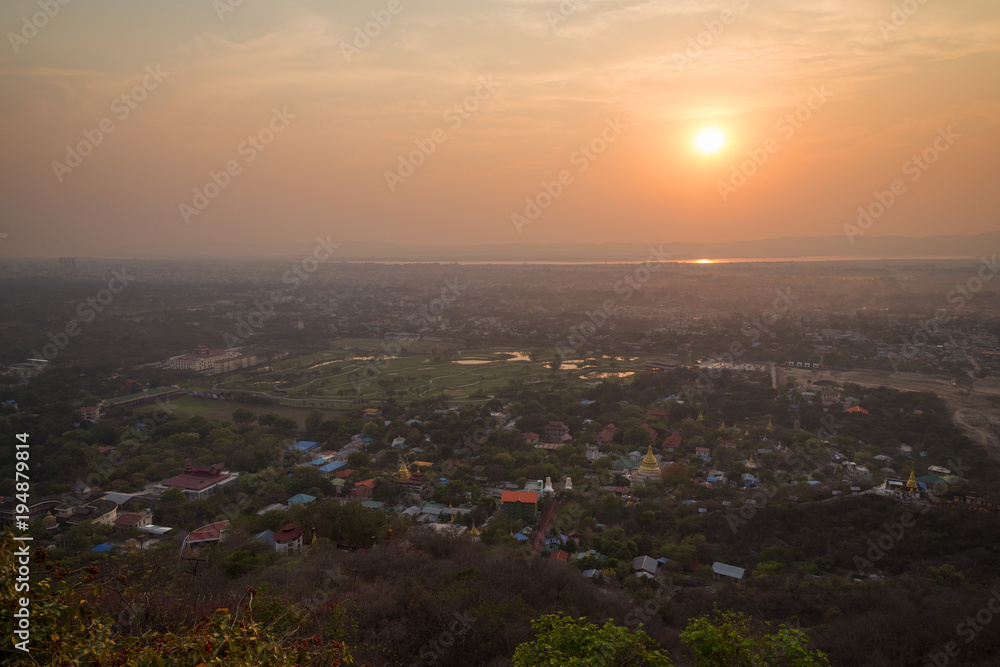 Beautiful sunset in Mandalay, Myanmar (Burma), viewed from above from the Mandalay Hill.