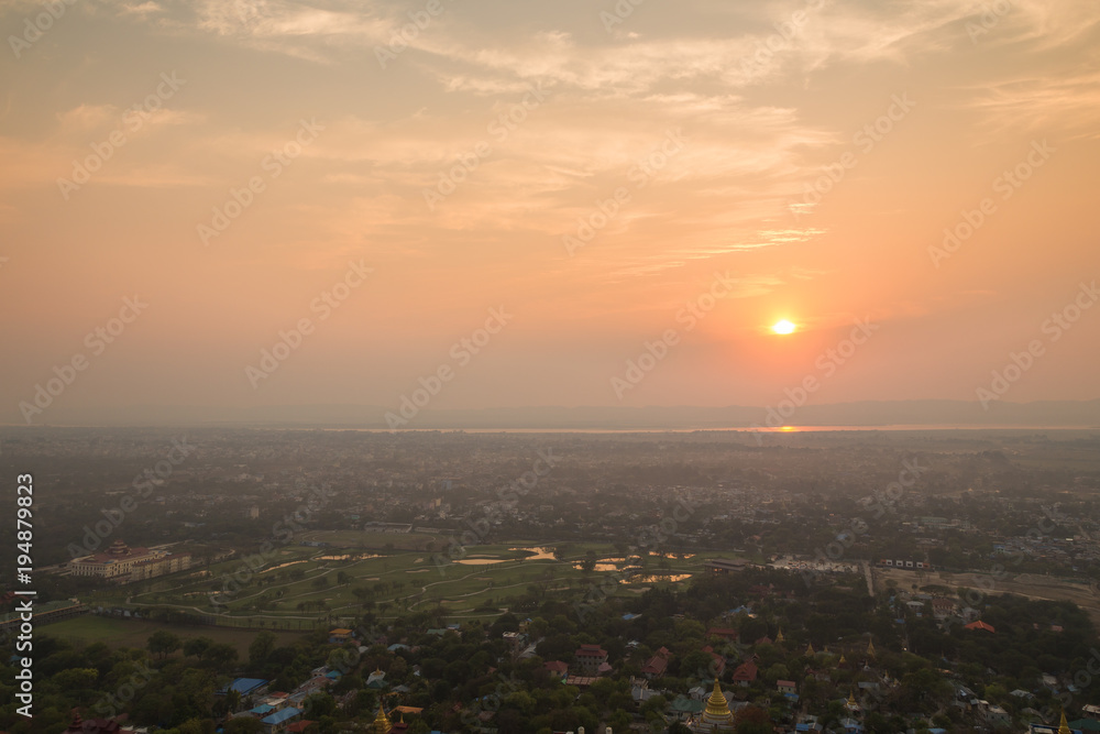 Beautiful sunset in Mandalay, Myanmar (Burma), viewed from above from the Mandalay Hill. Copy space.