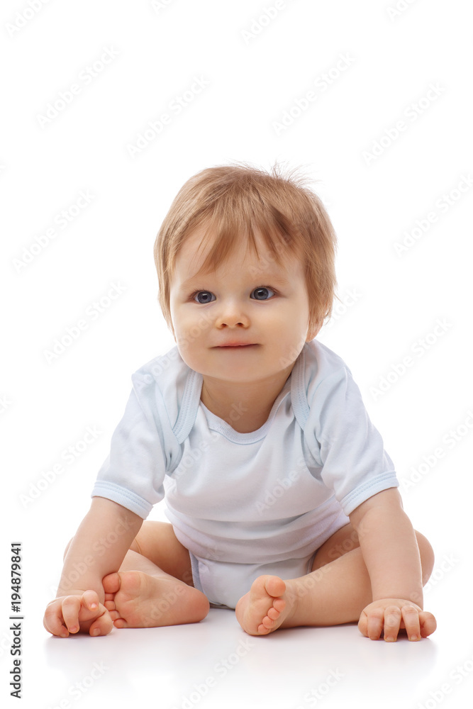 Baby is sitting on floor, isolated on white Baby is sitting on floor, isolated on white