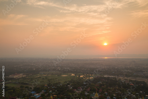 Beautiful sunset in Mandalay  Myanmar  Burma   viewed from above from the Mandalay Hill. Copy space.