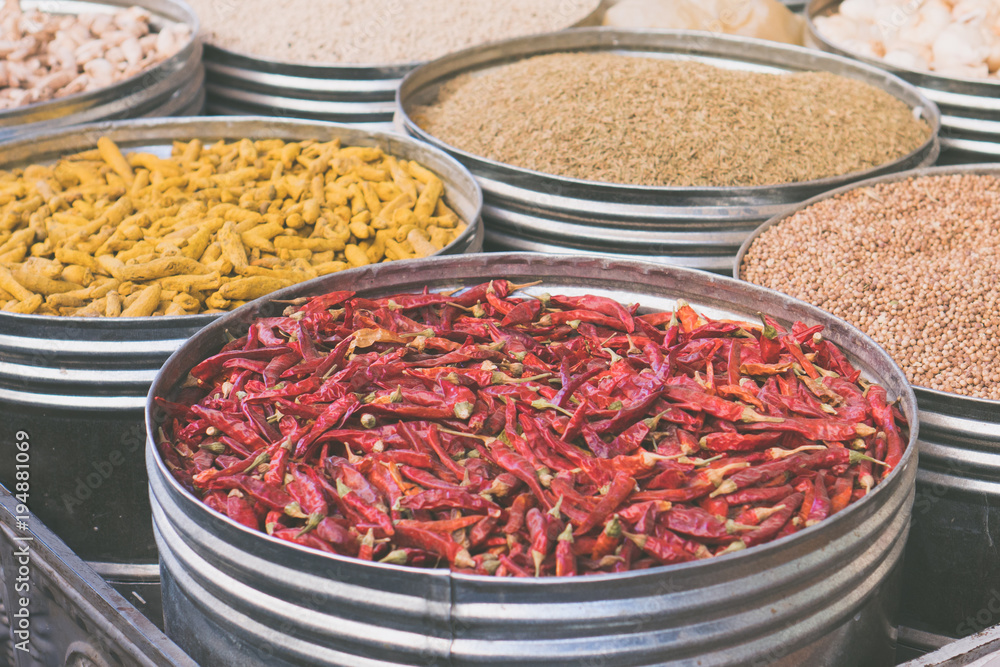Dried chili peppers and other spices in open market store Dried chili peppers and other spices in open market store