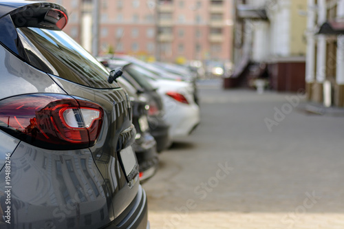 Parked cars along the sidewalk, side view © Руслан Галиуллин
