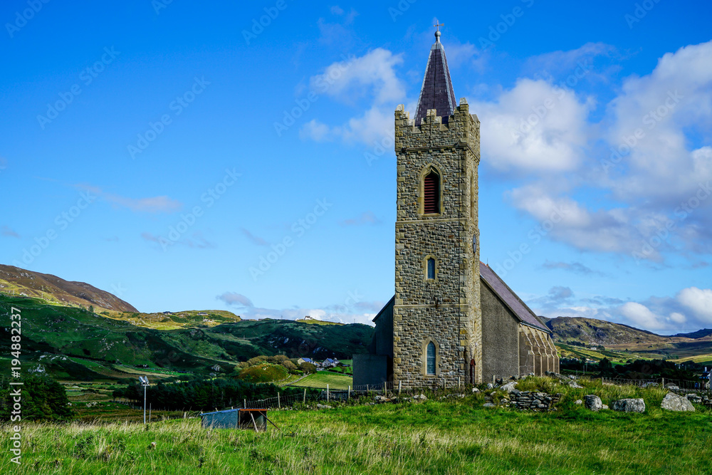 The standing stone is called a Turas it was created between the eighth and ninth century it stands outside the Church of Ireland in Glencolmcille.