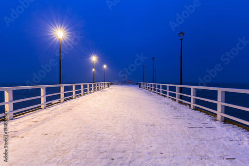 Snowy pier at Baltic Sea in Gdansk, Poland