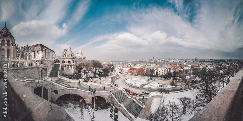 Fototapeta premium Budapest panorama. Fisherman's bastion in Buda castle, historical part of town, complex of the Hungarian kings. Aerial view of Budapest, Hungary. Hungarian Parliament and Danube river in background. 