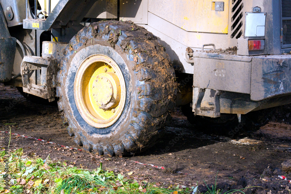 a bulldozer clears the site for construction