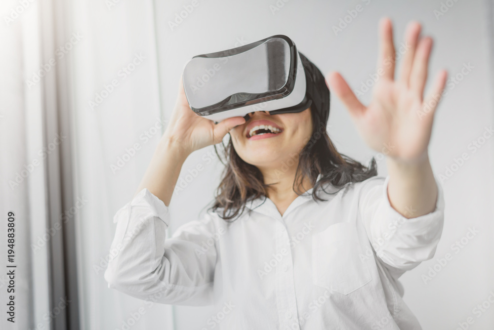 woman having fun while wearing VR headset woman having fun while wearing VR headset