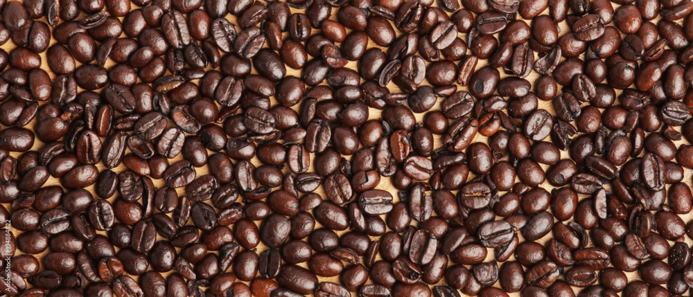 Coffee beans texture on wood Coffee beans texture on wood