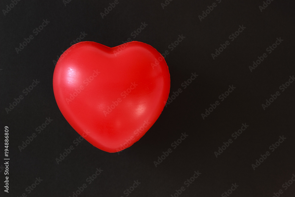 red heart on a black background red heart on a black background