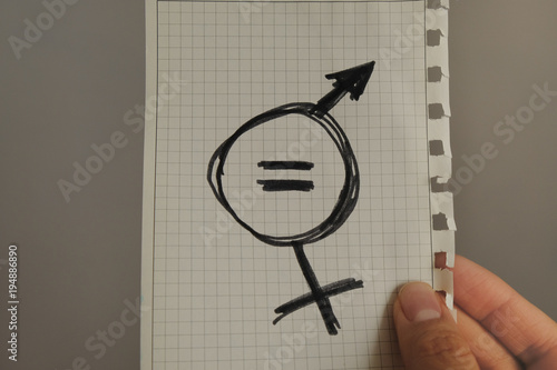 equals sign and a male symbol drawn on a piece of paper depicting the women sexual equality. gender equality drawn in it. fairness of treatment for women and men in the USA photo