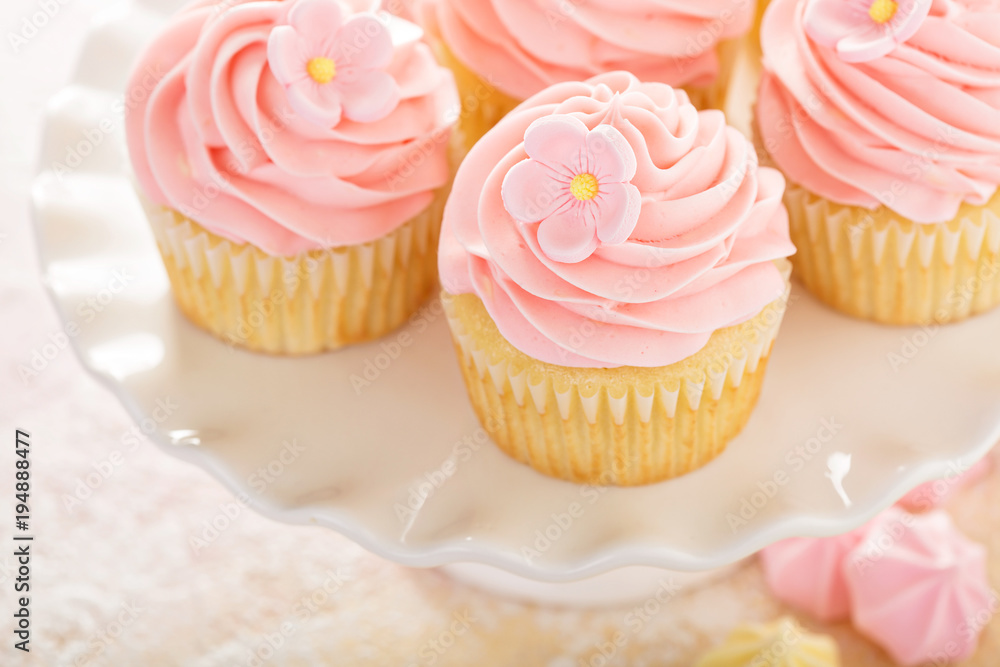 Vanilla strawberry cupcakes with sugar flower