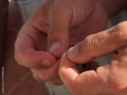 Hands preparing to fishing