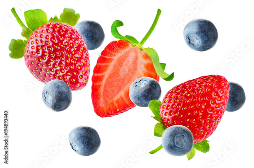 Fresh flying strawberries and blueberries