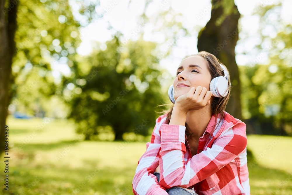 Young woman smiling enjoying the ambience and nature Young woman smiling enjoying the ambience and nature