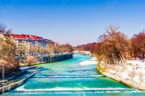 View on winter landscape and turquoise Isar in Munich