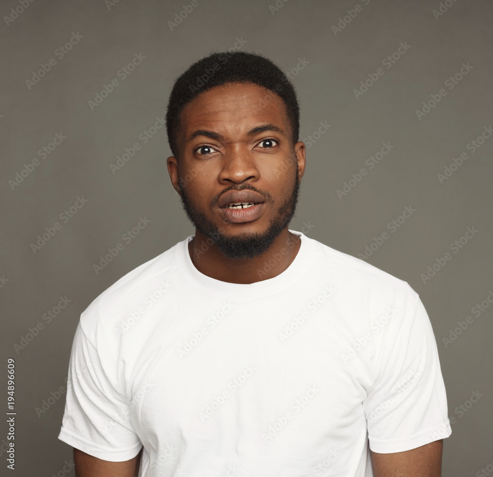 Inquiry facial expression, black man Inquiry facial expression, black man