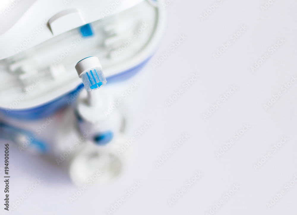 Oral hygiene. Irrigator for cleaning teeth on a white background. Oral hygiene. Irrigator for cleaning teeth on a white background.
