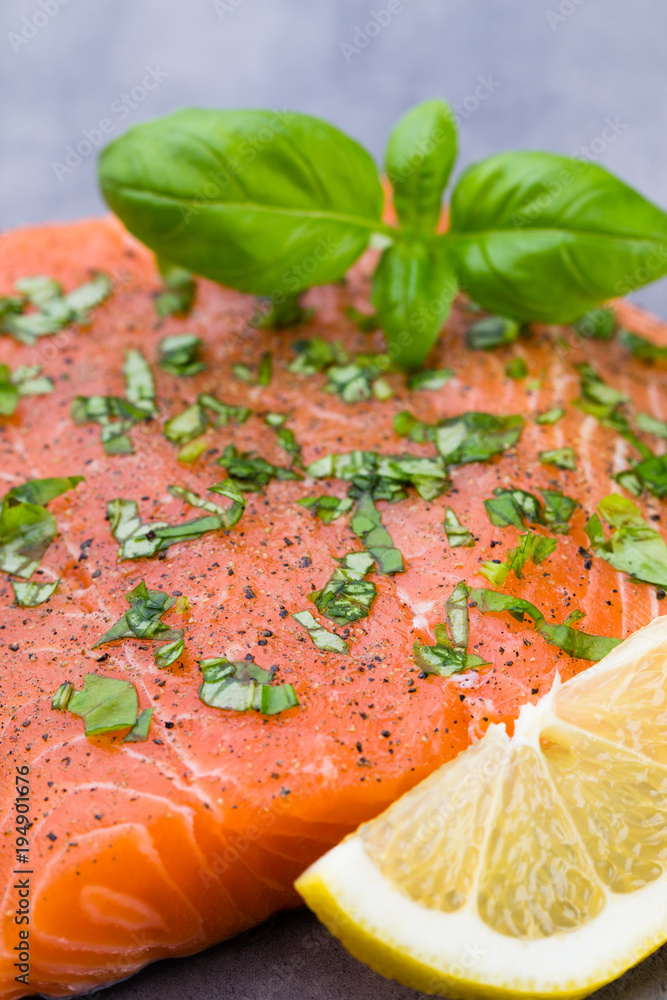 Fresh salmon fille with spice on the grey background. Fresh salmon fille with spice on the grey background.