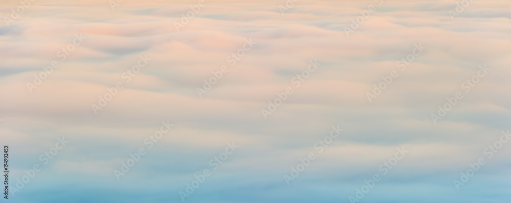 Fluffy creamy clouds soft morning light