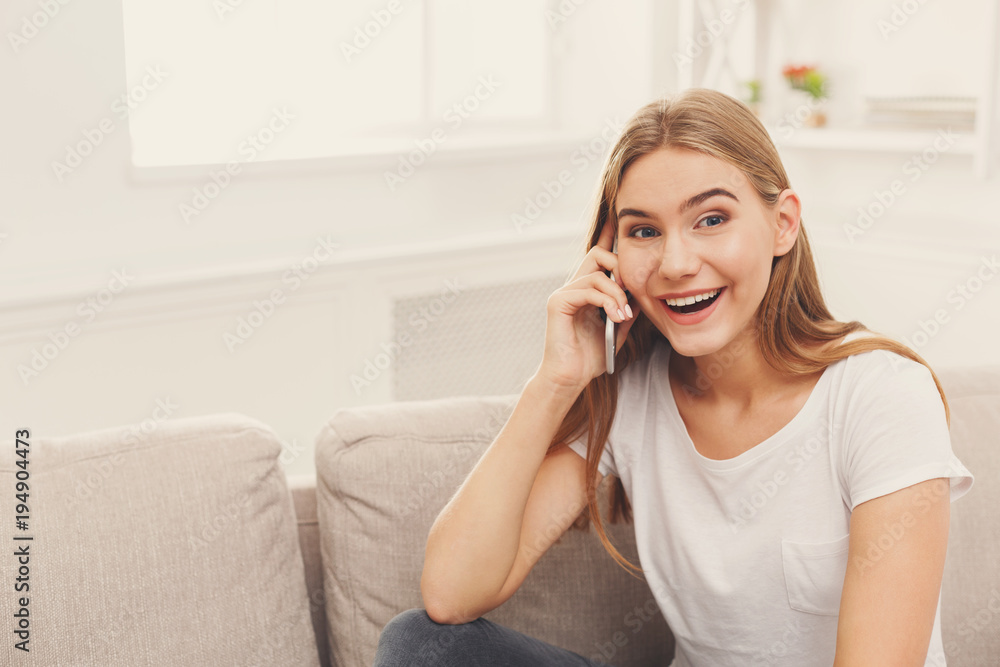 Smiling young girl calling on mobile phone Smiling young girl calling on mobile phone
