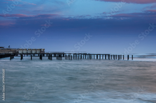 Pier with storm but soft sea © Luca