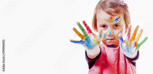 Beautiful little child girl with colorful painted hands. (art, childhood, color, creativity concept)