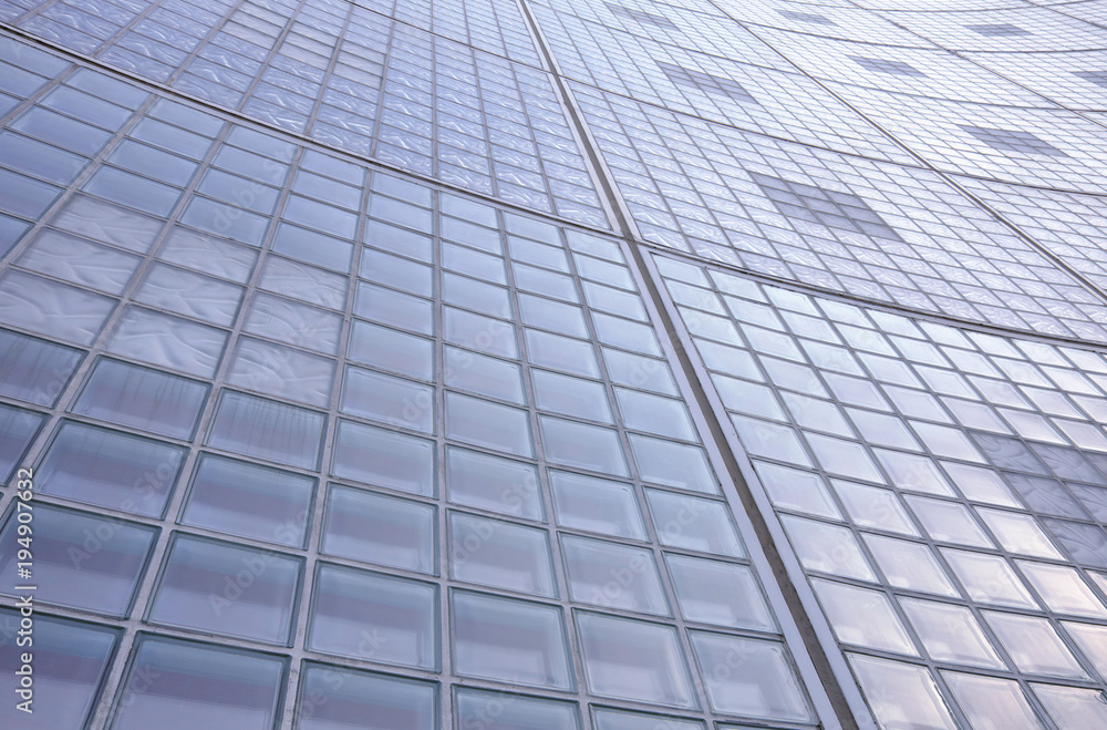 Glass brick wall pattern exterior of a tall building Glass brick wall pattern exterior of a tall building