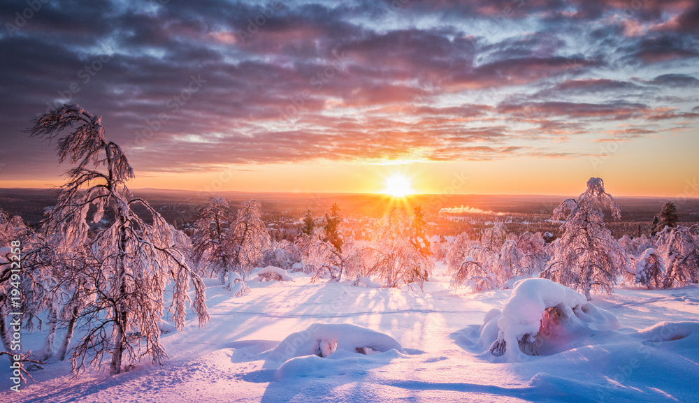 Winter wonderland landscape in Scandinavia at sunset
