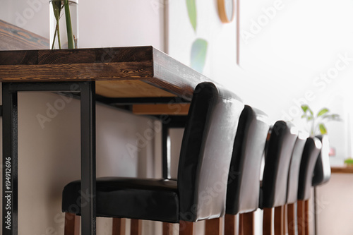 Wooden counter and chairs i...
