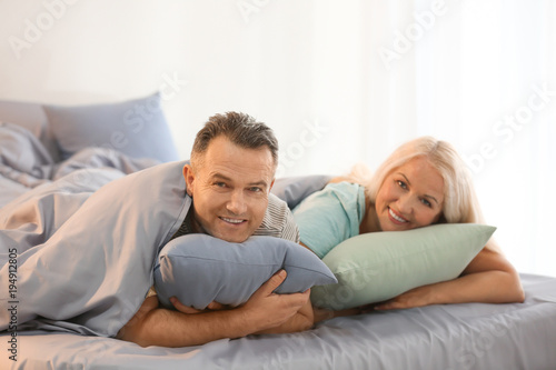 Senior couple in bed together