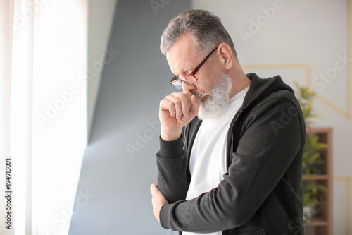 Portrait of senior man in c...