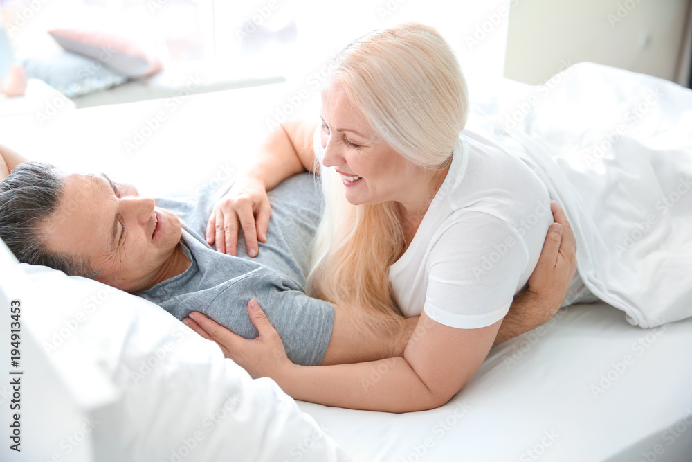 Fototapeta premium Senior couple in bed together at home