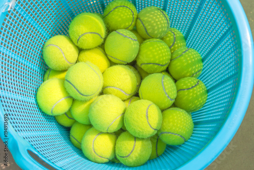 Tennis ball in a basket of blue.