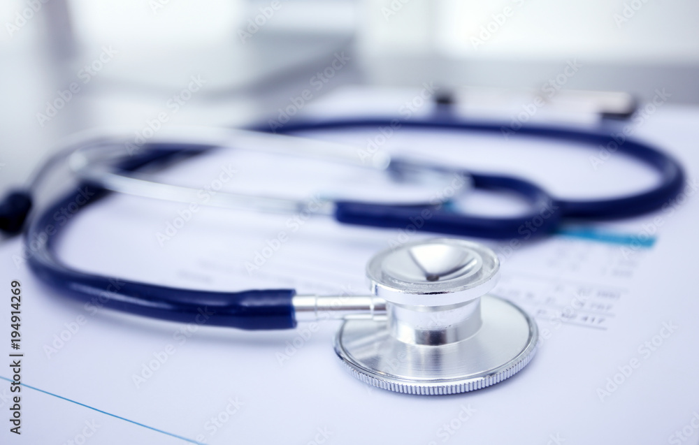 Medical equipment: blue stethoscope and tablet on white background. Medical equipment Medical equipment: blue stethoscope and tablet on white background. Medical equipment