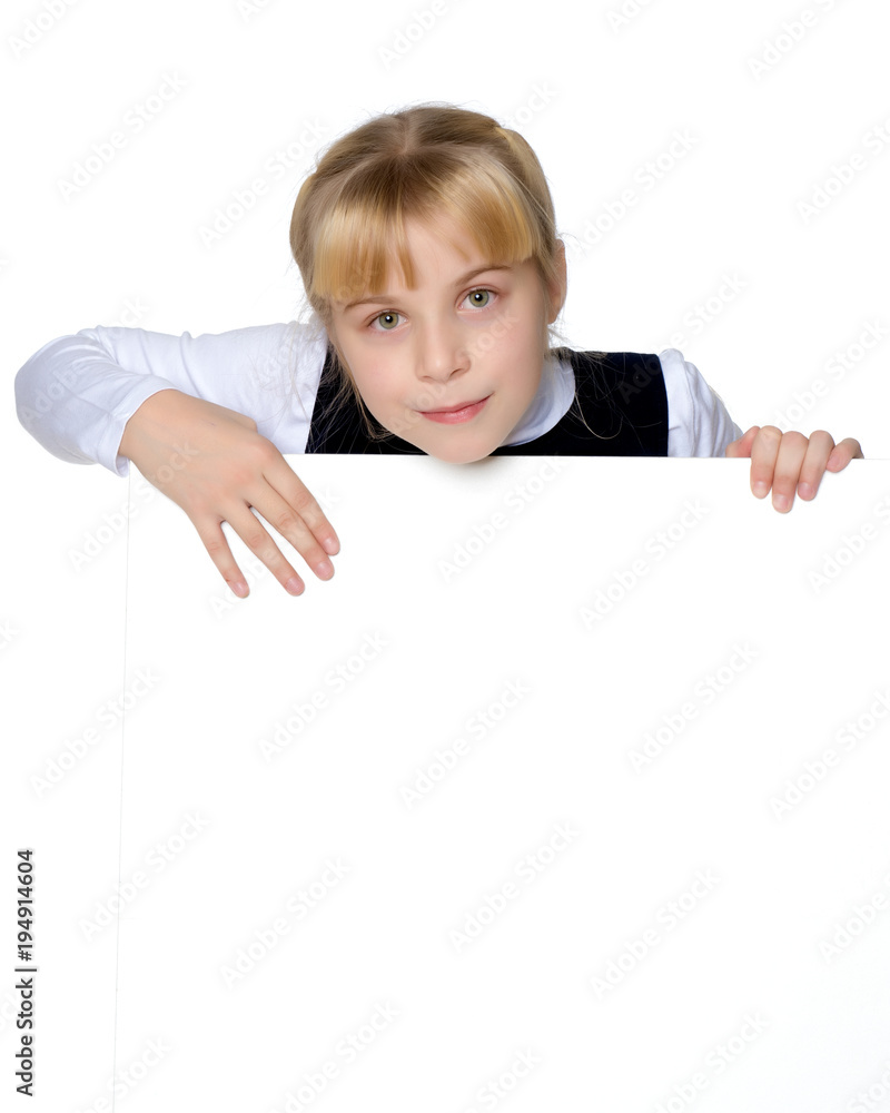 A little girl is looking from behind an empty banner. A little girl is looking from behind an empty banner.