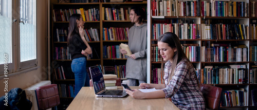 Female student studying in university library