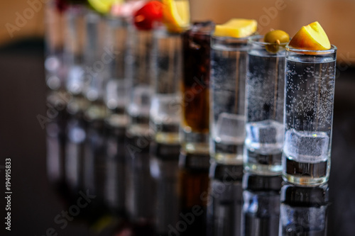 A shots of alcohol are reflected on the surface.
