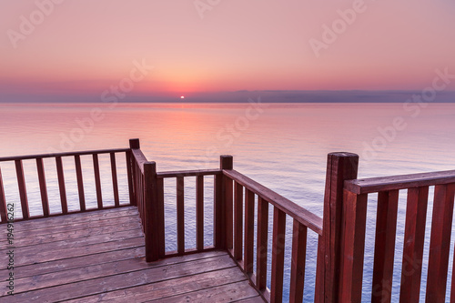 Picturesque Viewpoint on sunset seascape over Mediterranean sea in European country from wooden terrace.