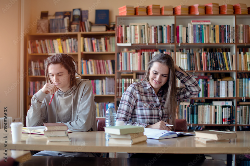 Happy students in library Happy students in library
