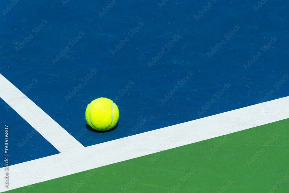 Tennis ball on the corner of court