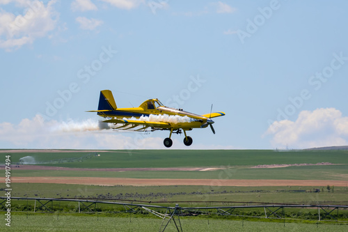 Crop Duster spraying field 