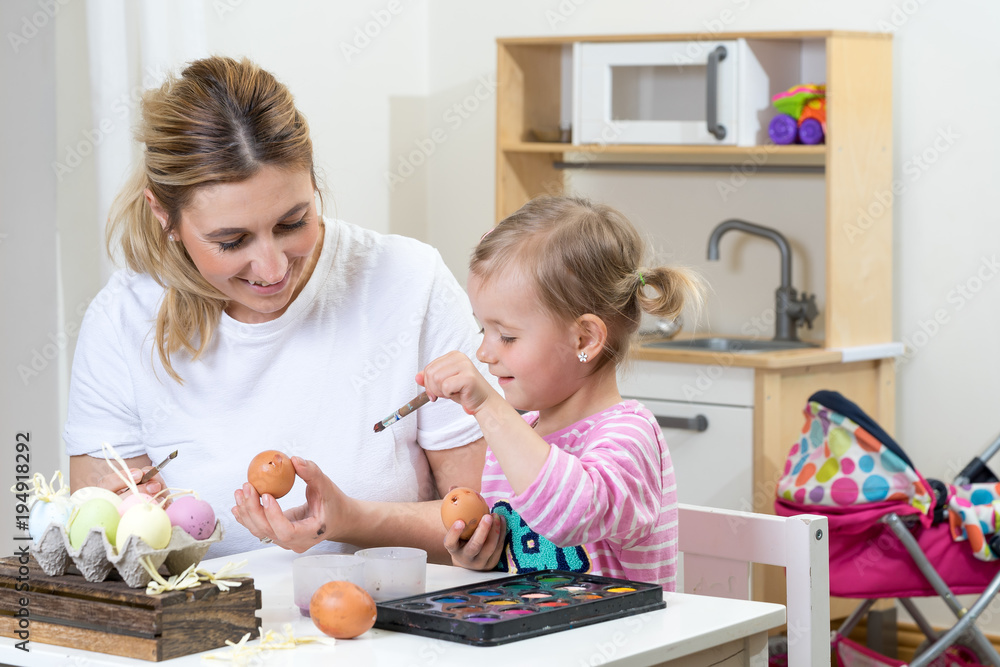 Fototapeta premium mom mum daughter have fun decorating easter egg kids room kitchen time together
