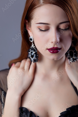 woman with make-up and earrings