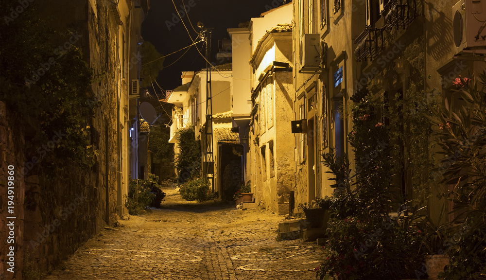 Night view of historical, old street in old town of Cunda (Alibe