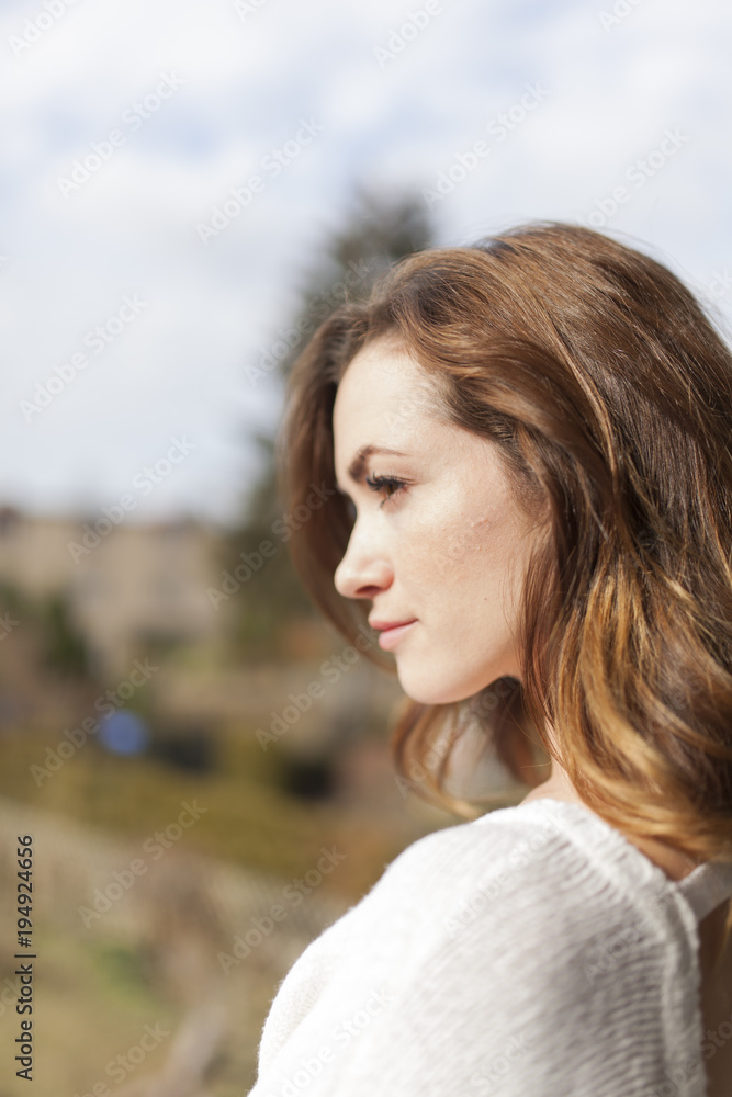 profile portrait of a young women with blurry bouquet profile portrait of a young women with blurry bouquet